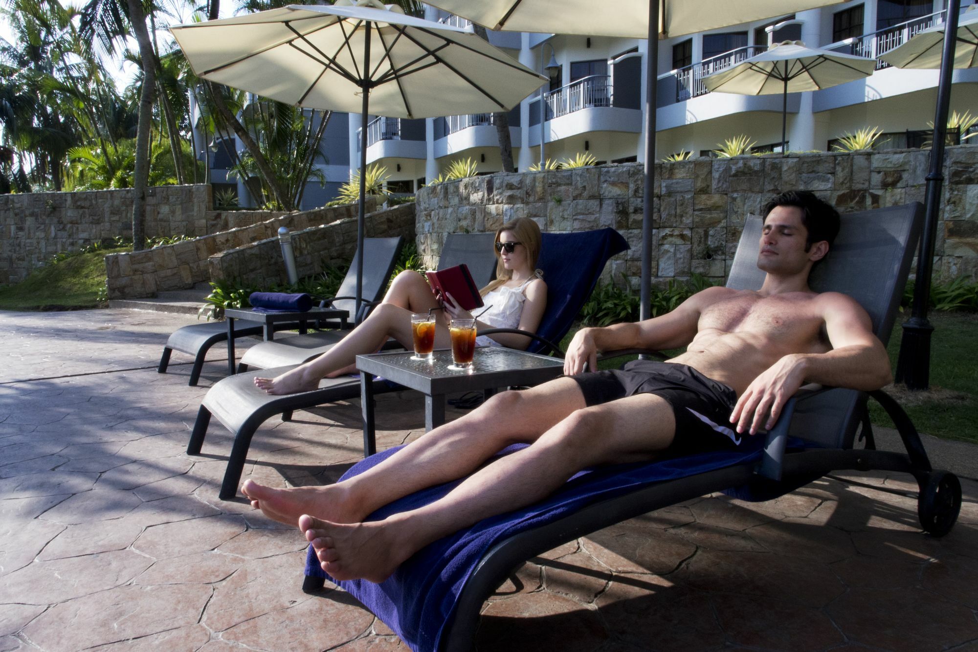 Thistle Port Dickson Resort Buitenkant foto Sunbathers at a resort in Fiji